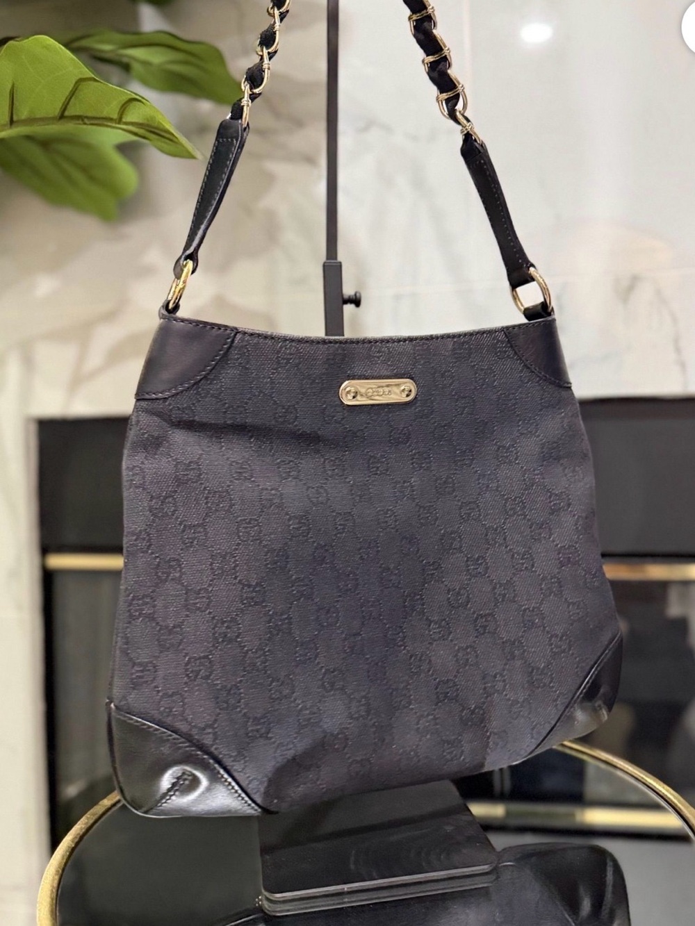 Gucci canvas Capri chain shoulder bag. Black monogram with gold hardware.